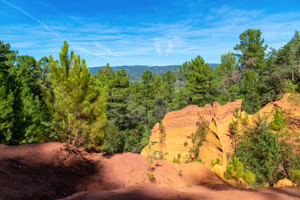 istock Roussillon, red rocks colorful ochre canyon in Provence 1251120301