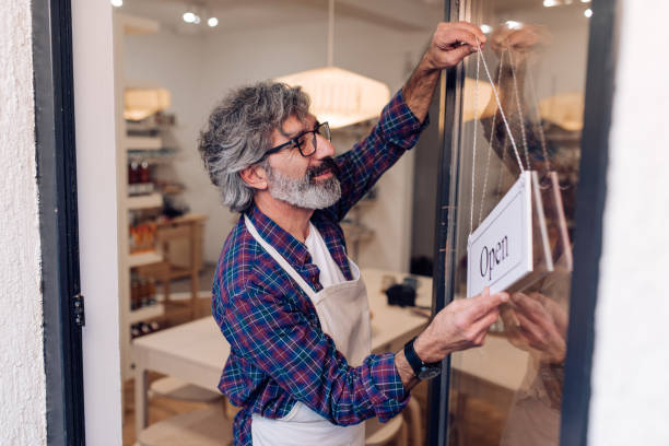 istock Mature entrepreneur reopening his store 1251122322