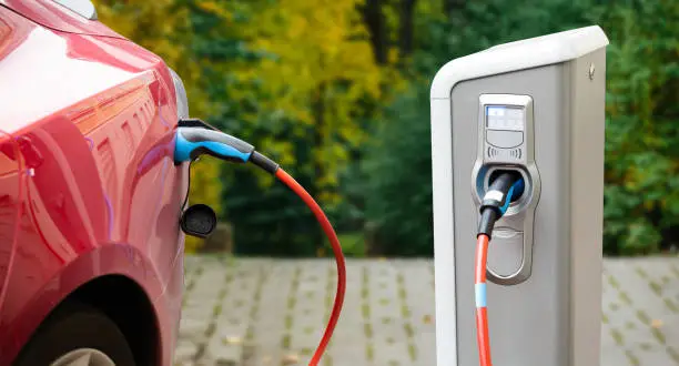 Photo of Close up of a charging electric car