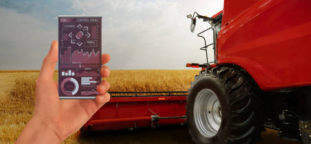 istock A farmer controls an autonomous combine harvester 1251125527