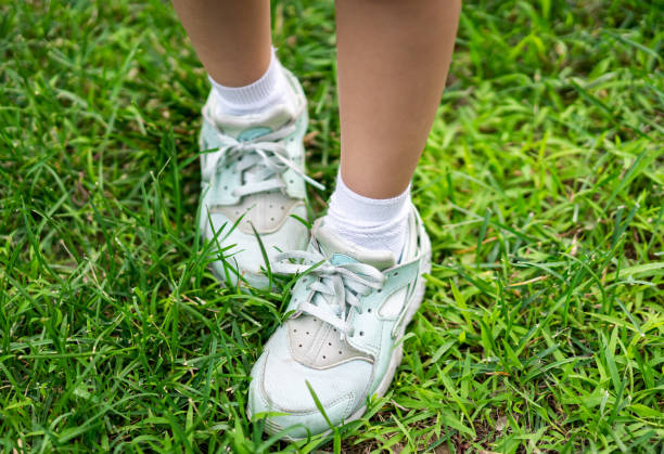 istock Little Girl Standing on the Lawn 1251125568