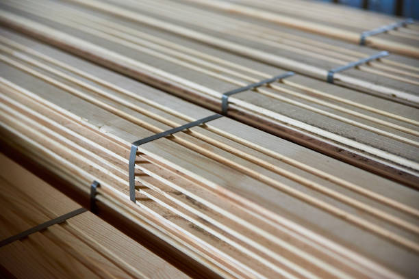 istock The facing wooden board is stored in a warehouse. 1251133522
