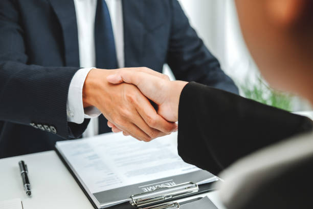 istock Business Shaking hands greeting new colleagues after during job interview 1251133641