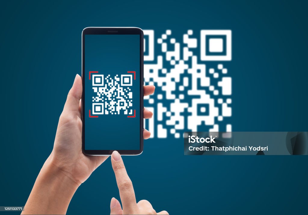 Hand using mobile smart phone scan Qr code on blue background. Cashless technology and digital money concept Hand using mobile smart phone scan Qr code on blue background. Cashless technology and digital money concept. QR Code Stock Photo