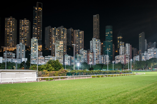 Empty race track and skyline background, Horse racing course in Hong Kong Jockey Club, Happy Valley