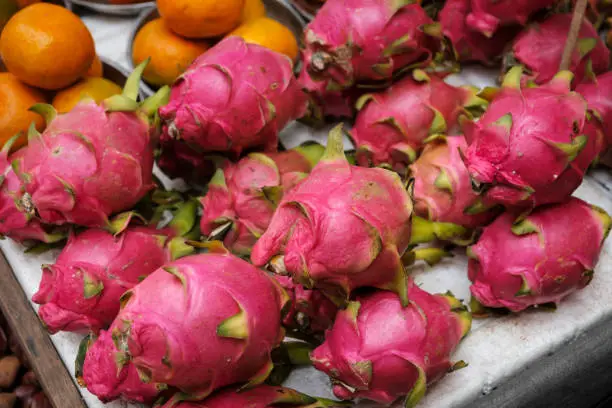 dragon fruit on market, pile of dragonfruits