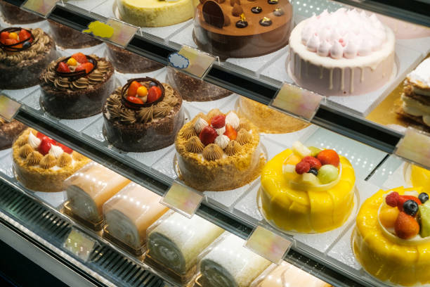 istock sweets and cakes on display in bakery shop - 1251134119