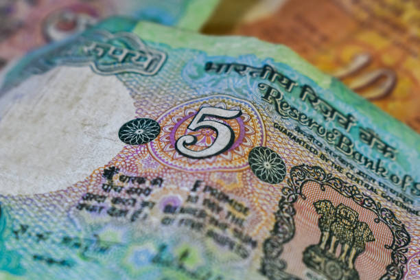 istock Background image of old Indian currency notes. Old Indian 5 rupee note. 1251134295