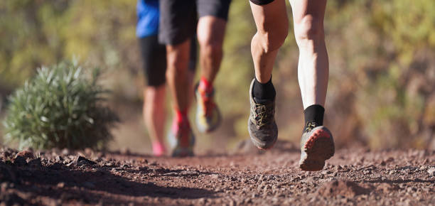 istock Runners running shoes on trail run 1251137790