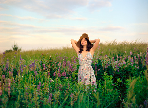 Portrait of young Caucasian woman in summer/spring outdoors