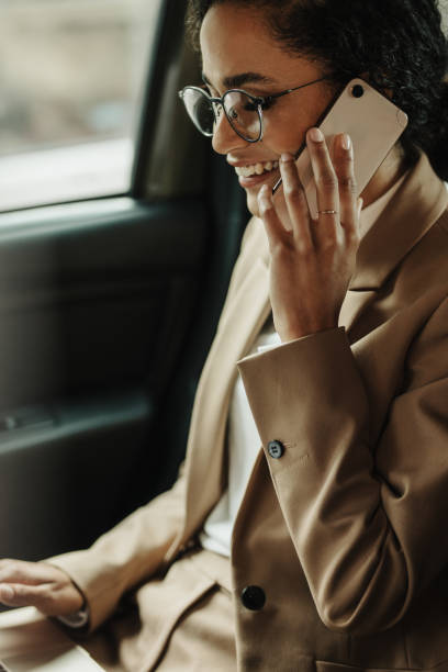 istock Female entrepreneur working while traveling in a car 1251138748