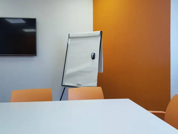 meeting room with blackboard and sheets