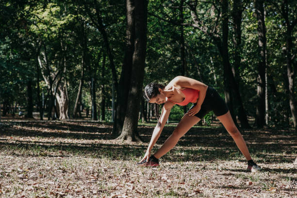 istock Woman stretching outdoors 1251140952