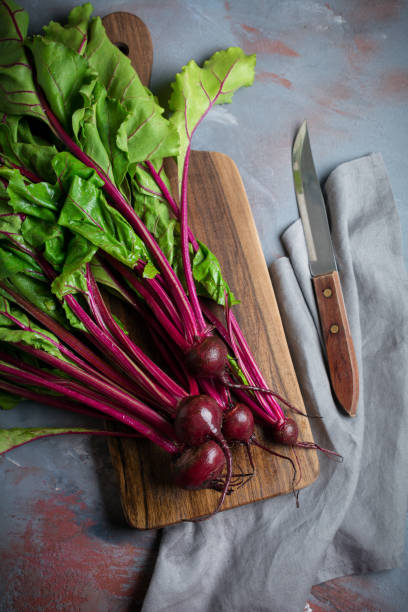 istock Fresh young organic beet on a gray concrete background. Selective focus. Top view. 1251141403
