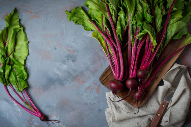 istock Fresh young organic beet on a gray concrete background. Selective focus. Top view. 1251141500
