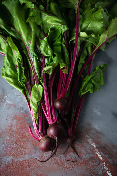istock Fresh young organic beet on a gray concrete background. Selective focus. Top view. 1251141511