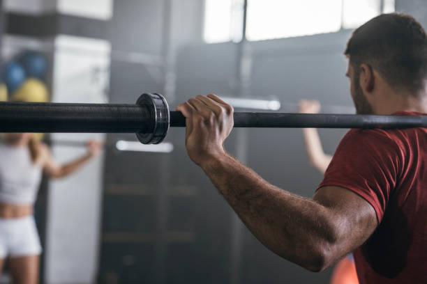 istock Sportsman Lifting Weights 1251142031