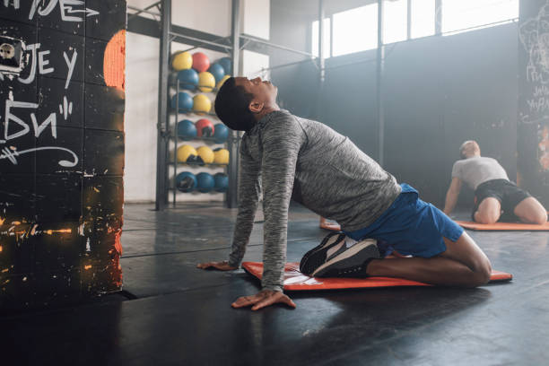istock Sportspeople Doing Stretching Exercises 1251142049