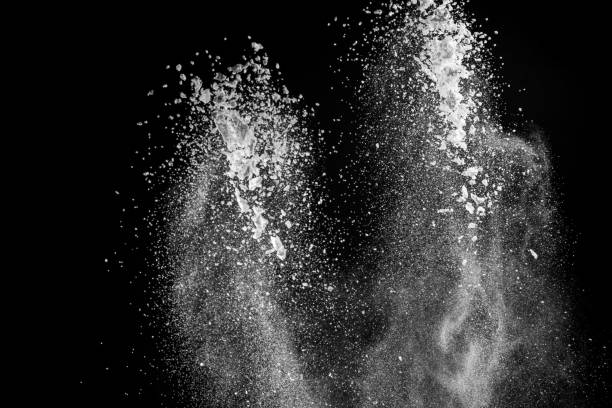 istock Burst of white powder with flour and sugar creating a beautiful pattern isolated on black background 1251143433