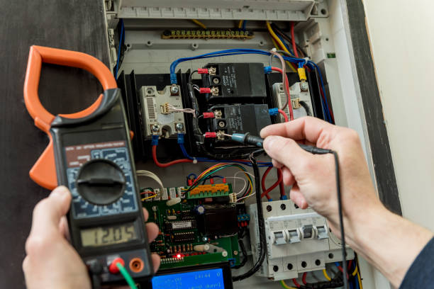 istock The man is repairing the switchboard voltage with automatic switches. 1251146475