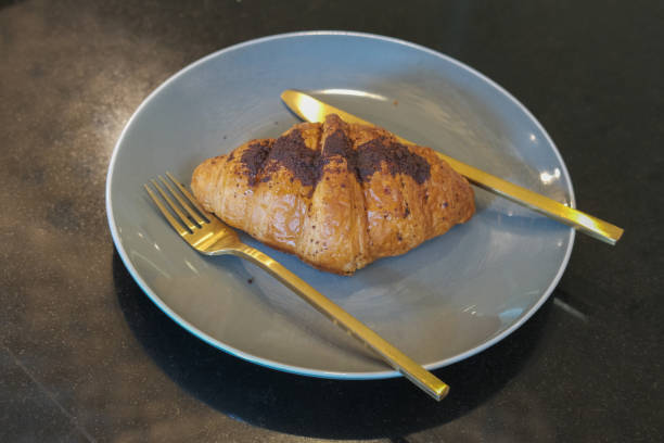 istock Chocolate croissant on a plate ready to eat 1251148472