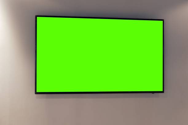 istock Green screen on digital LCD television on white wall 1251148496