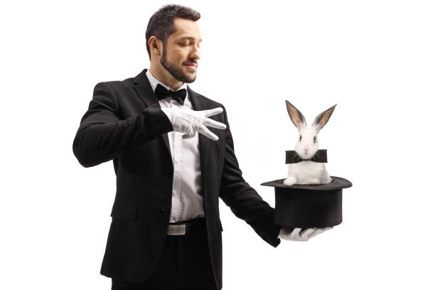 istock Magician performing a trick with a top hat and a rabbit 1251152162