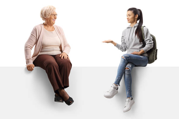 istock Female student on a panel talking to an elderly lady 1251154188