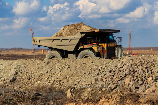 istock Huge yellow mining dump truck working in iron ore quarry. Mining industry 1251154855