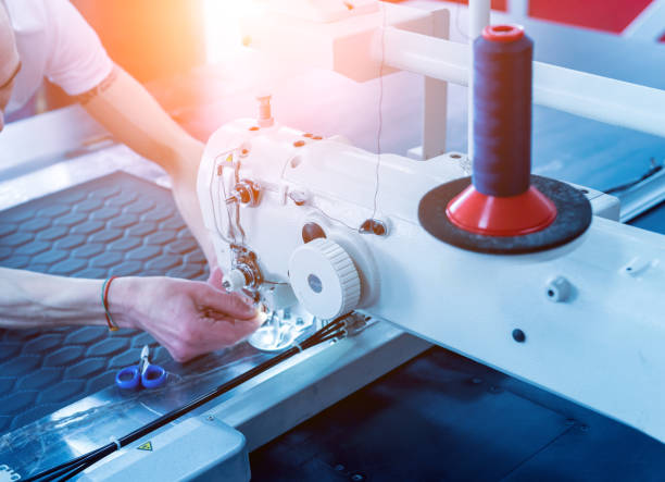 istock Fabric industry production line. Textile factory. Working tailoring process 1251155022