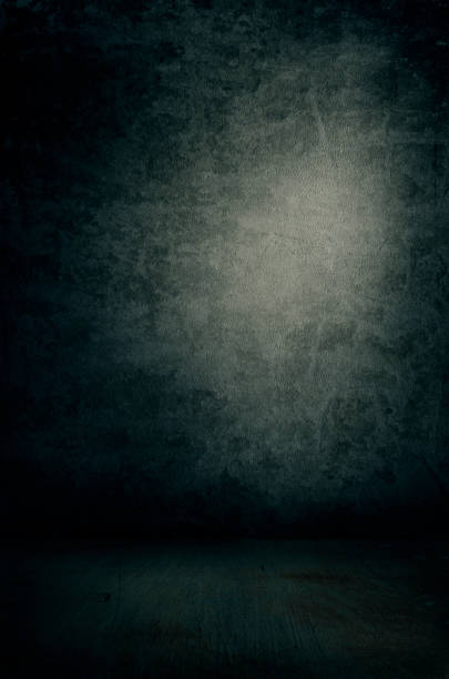istock Grunge textured concrete wall and floor with spot light 1251155907