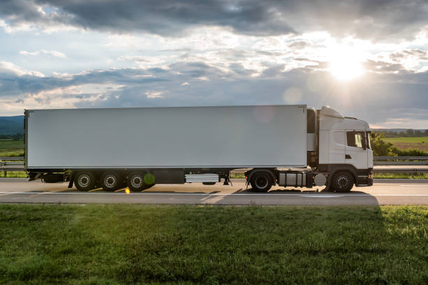 istock Big White truck on highway 1251156221