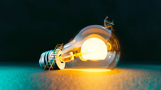 Lightbulb concept with man sitting on top of it an getting great ideas