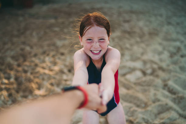 istock Kid on beach holiday playing with his father 1251157322