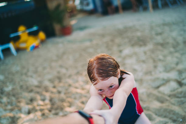istock Playful kid on beach holiday 1251157368