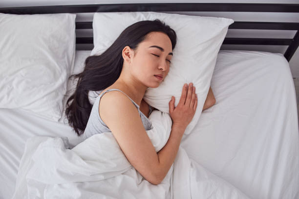 istock Charming Asian lady resting in her bad 1251161060