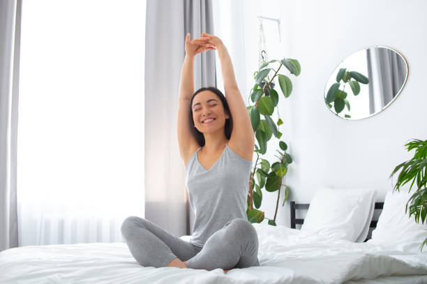 istock Young woman feeling happy after waking up 1251163563