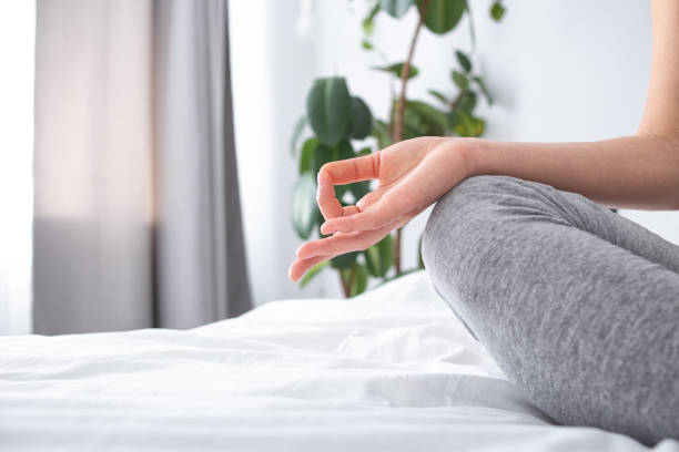 istock Female doing meditation in morning at home 1251163565