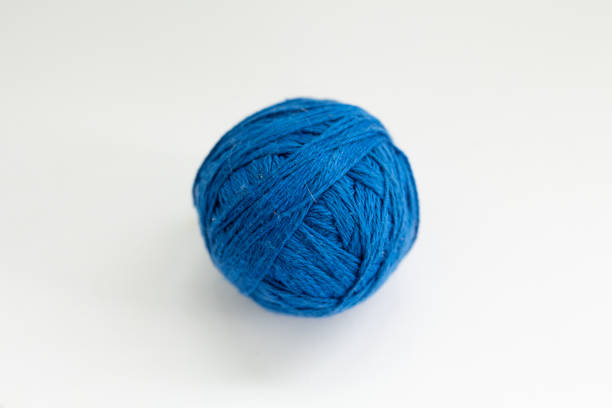 istock ball of blue thread on a white background 1251167480