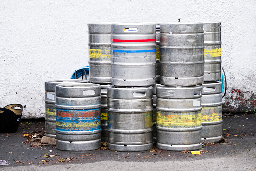 Beer and alcohol barrel kegs in a stack group UK