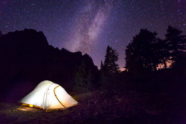 istock Scenic view of illuminated campsite at night 1251176285