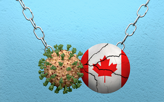 Canadian flag is demolish by a wrecking ball made from Coronavirus Covid-19. High resolution image 3D render with copy space for all your social media and print crops.