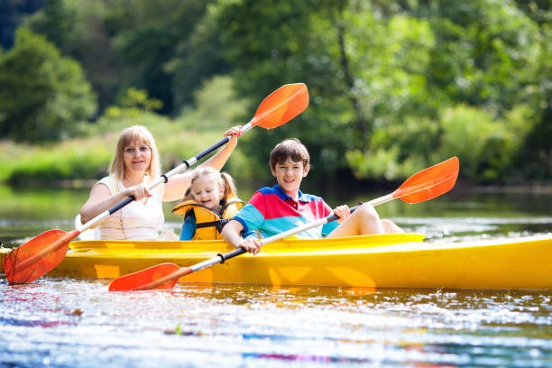 istock Child on kayak. Kids on canoe. Summer camping. 1251180301