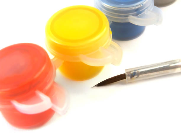 istock Paint cans and paint brush isolated on white background 1251181411