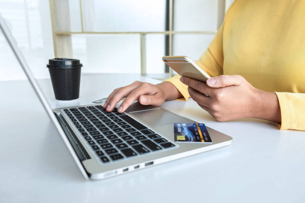 istock Woman using credit card and smartphone register security code payments online shopping and customer service network connection market, using technology on laptop, Internet Online shopping concept 1251185103
