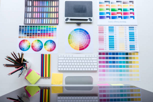 istock Modern office workplace with tablet, Graphic designer and color swatch samples at workplace, top view workspace 1251185310