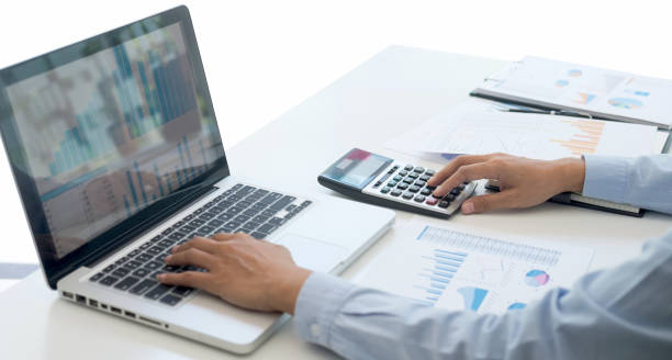 istock Professional at work, business woman working and analyzing on laptop with calculate statistics of financial document data graph for new project of business strategy and market growth at workplace 1251185319