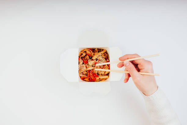 Woman eating chinese takeaways