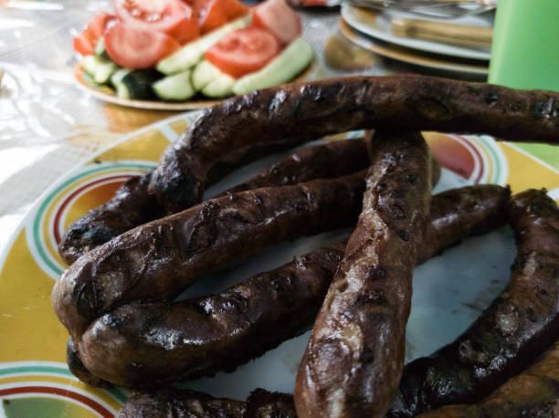 istock Fried sausages with vegetables behind 1251187070