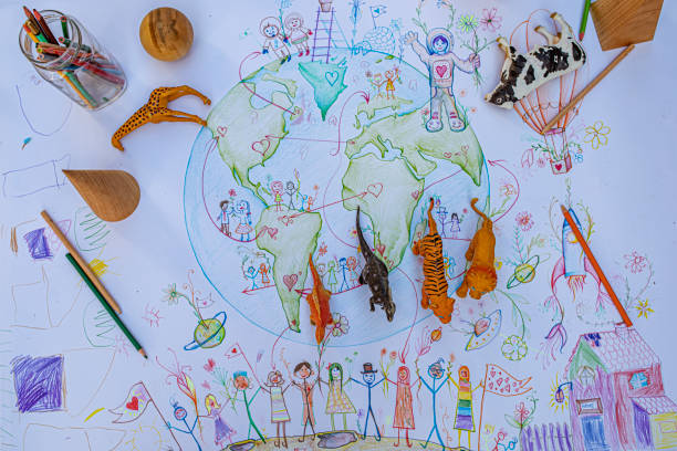 istock Child's drawing of the planet Earth (people, rainbow, multiculturalism) 1251187106